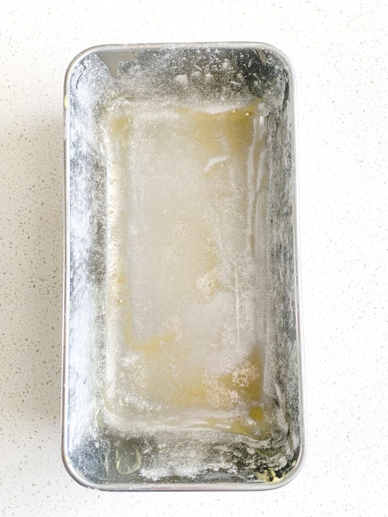 loaf pan prepared for beer bread