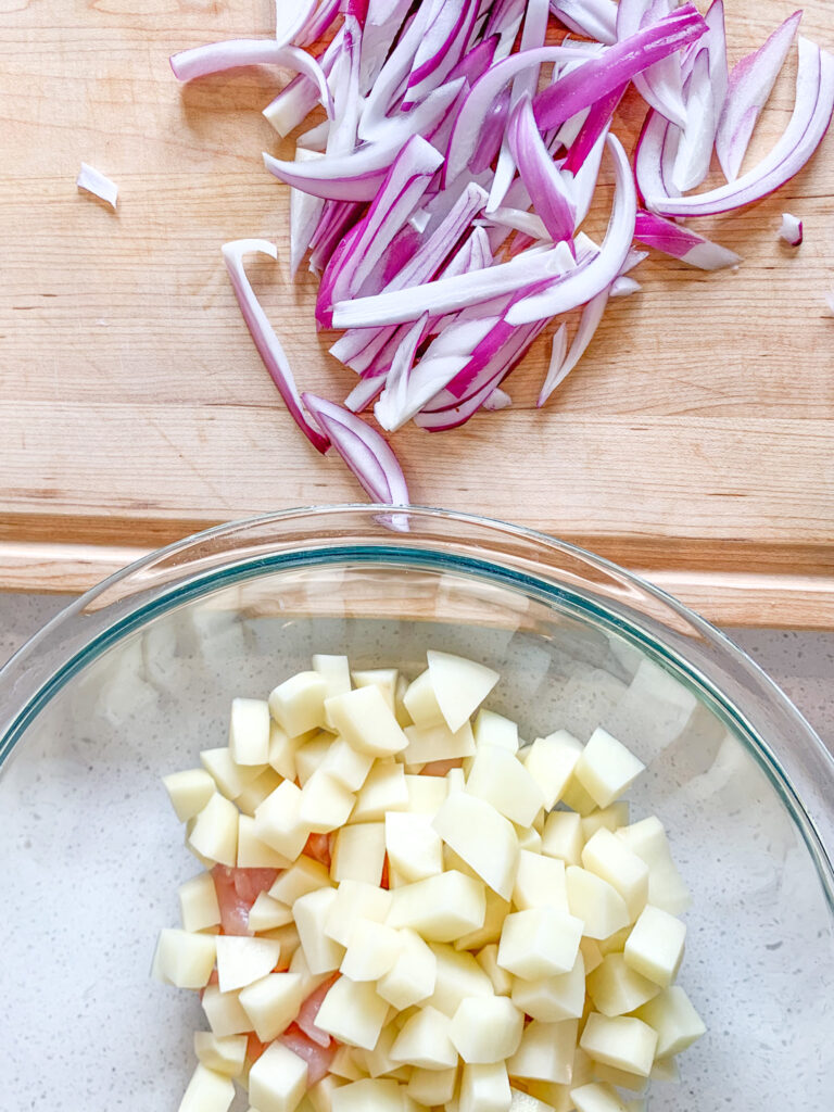 red onion sliced up for sheet pan meal