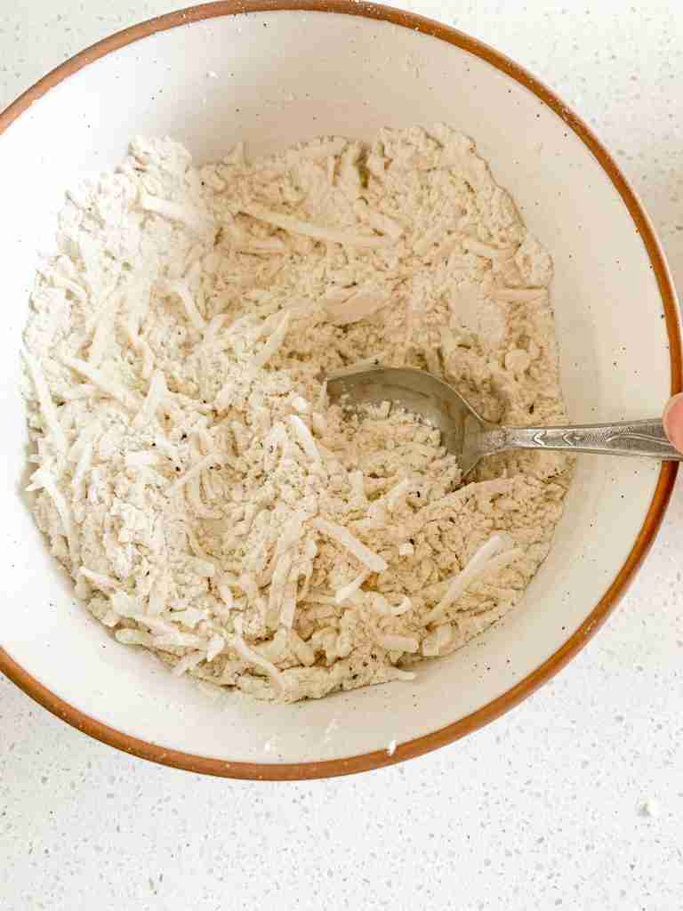 mixing a bowl of dry breading