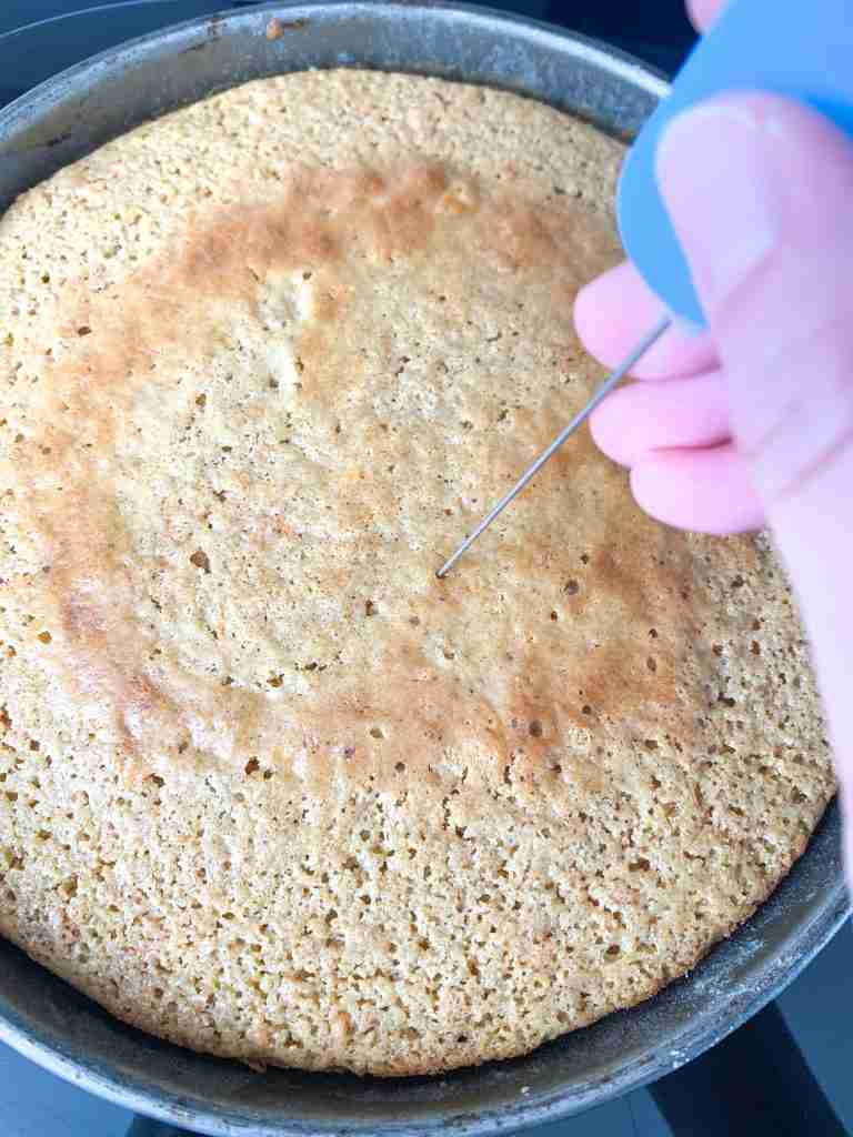 testing a cake to see if it's fully baked