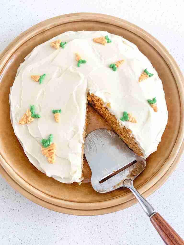 cake with a slice out of it and a server on the plater
