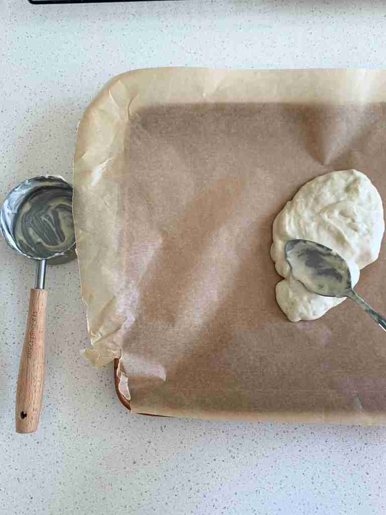 measured out starter being spread on paper