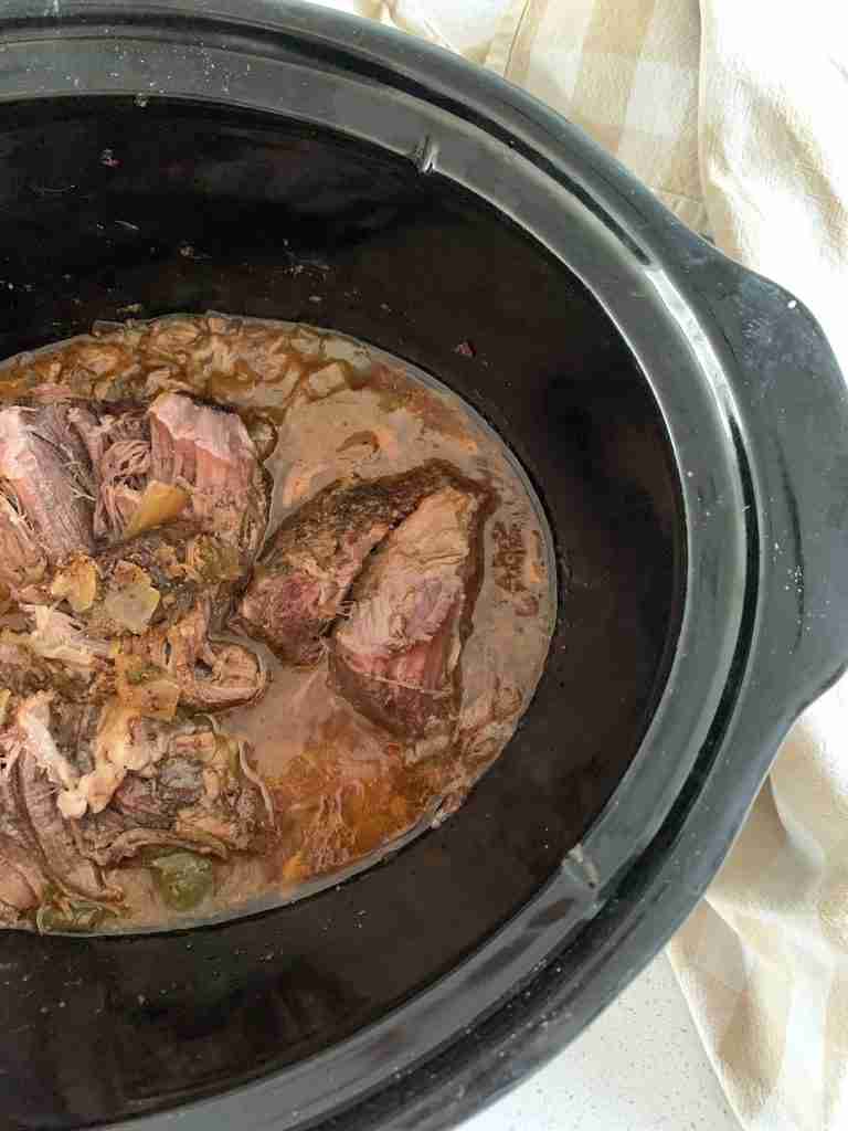 slow cooker full of beef roast