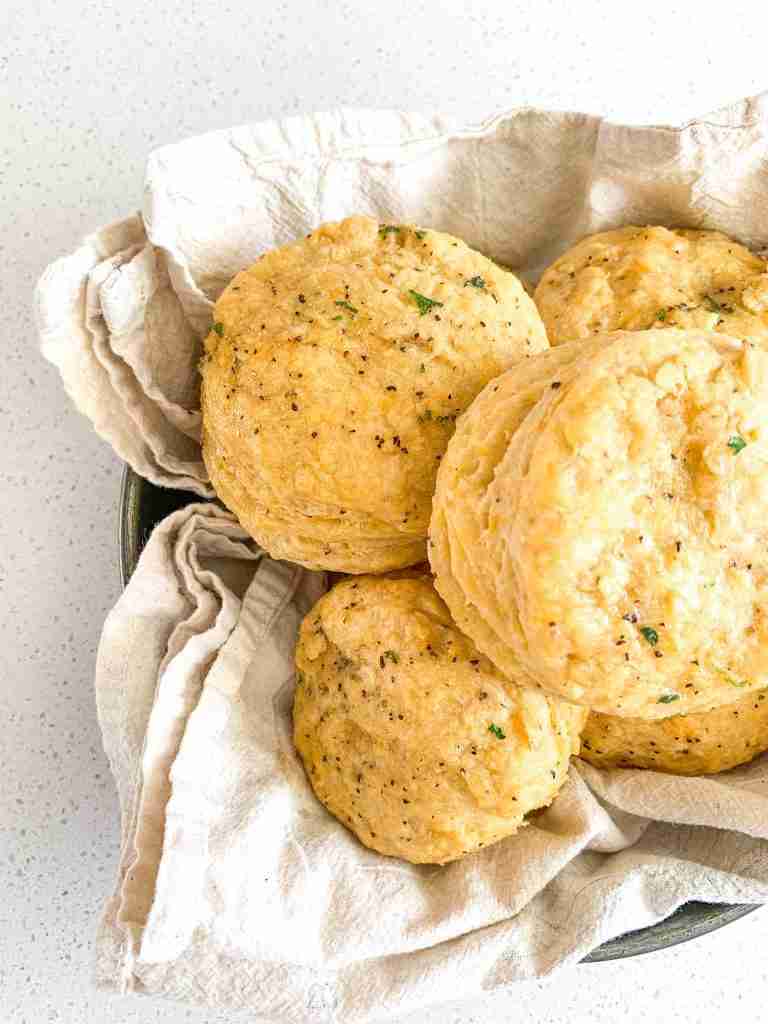 cheddar bay biscuits stacked in a pan