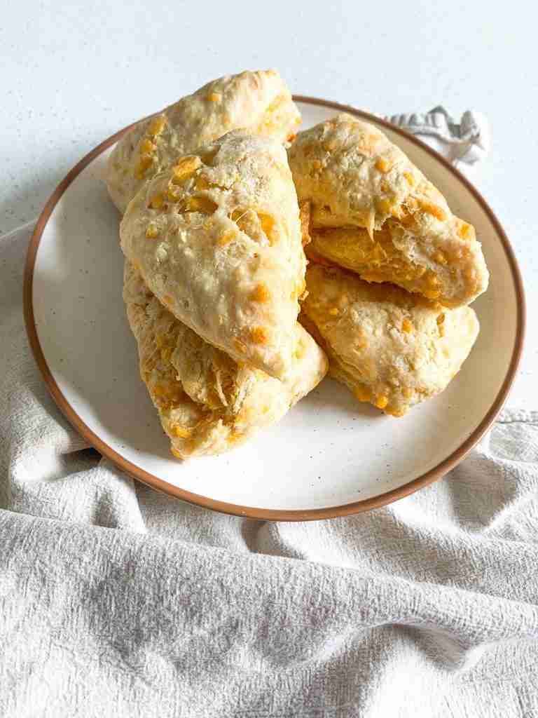 scones on a plate with a towel around it