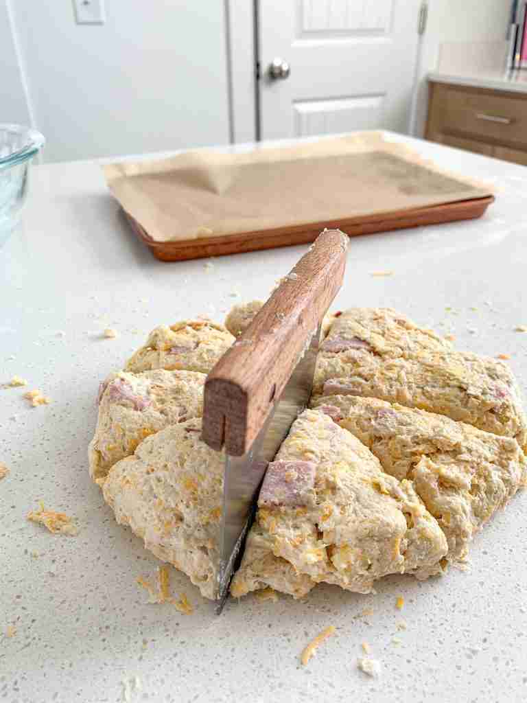 scone dough being cut into 8 pieces