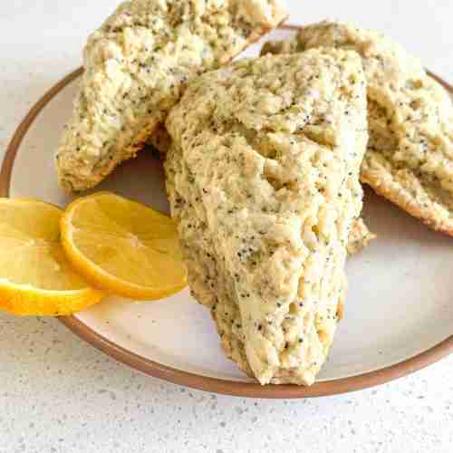 scones on a plate with lemon slices
