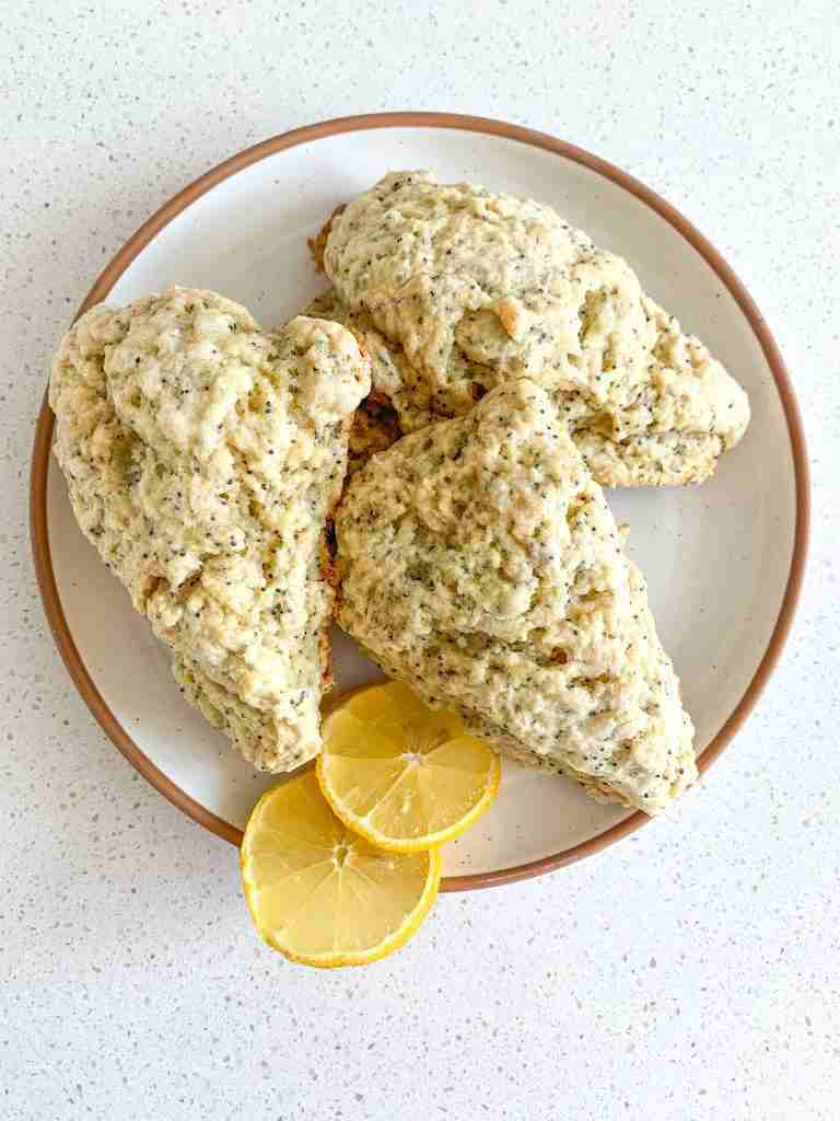 scones on a plate with lemon slices