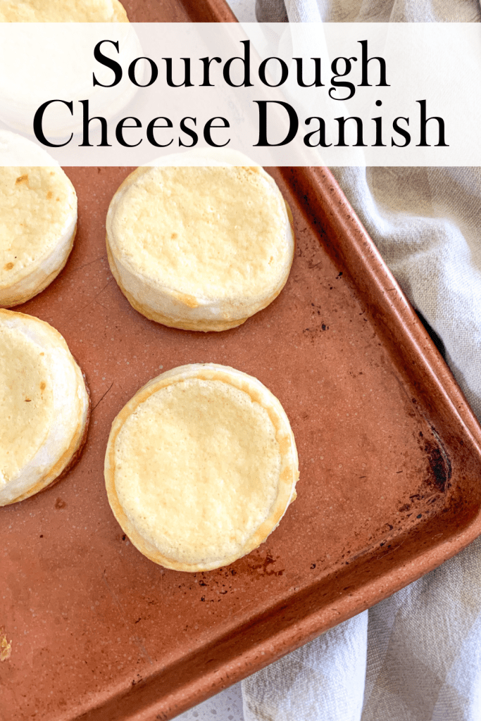 danish pastries on a baking sheet with a towel beside them