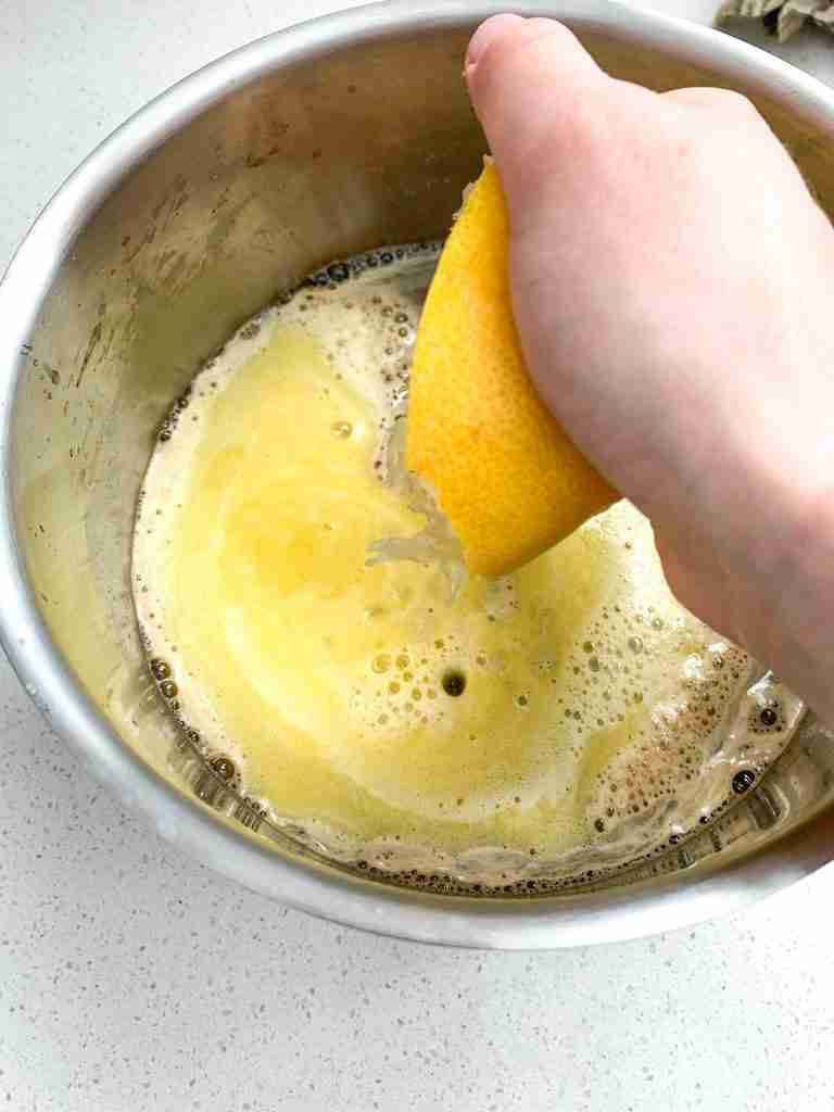 lemon juice being squeezed