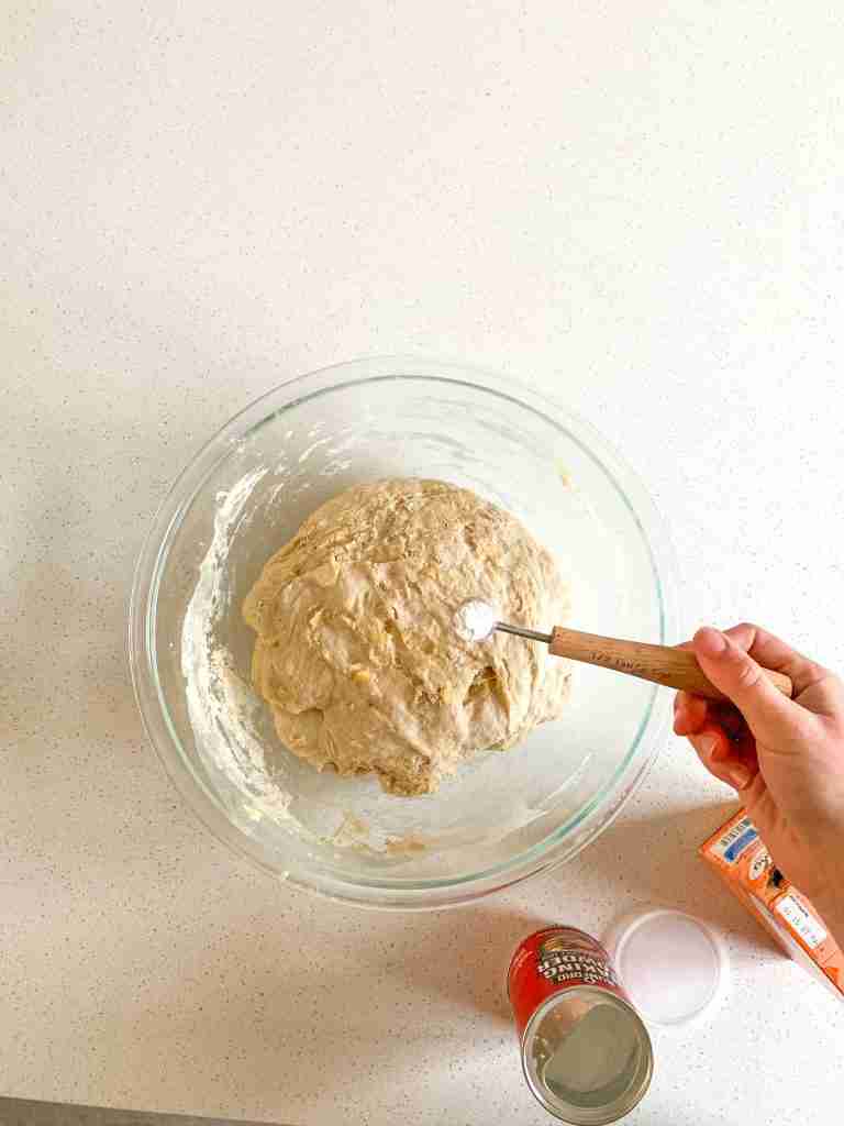 adding baking soda and powder to dough