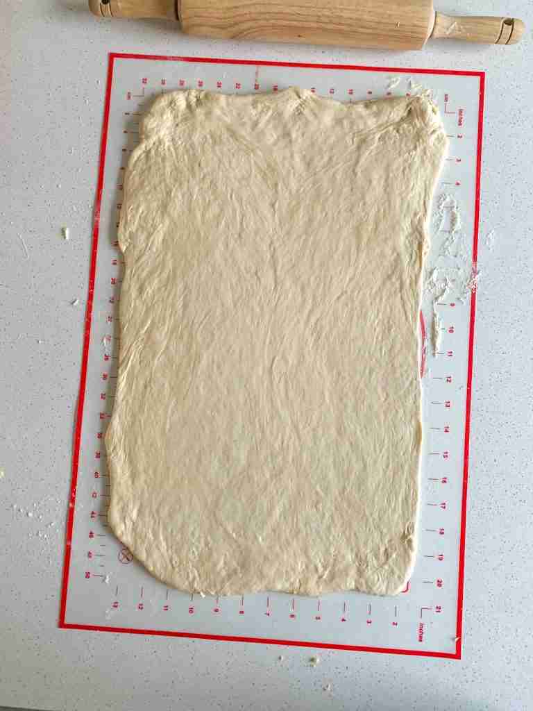 dough rolled out on a mat