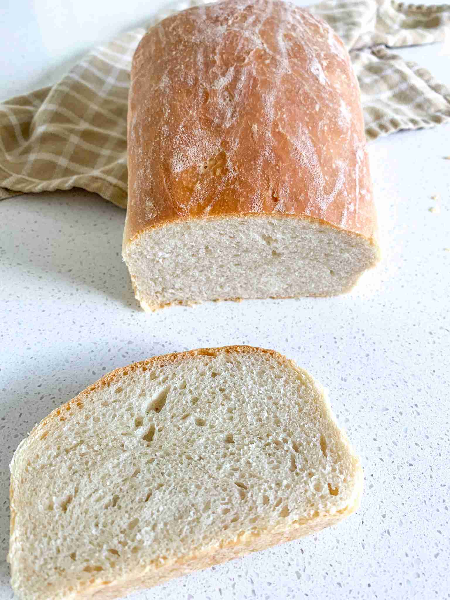 loaf of bread with a slice cut off