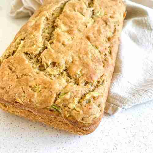bread loaf on a towel on the counter