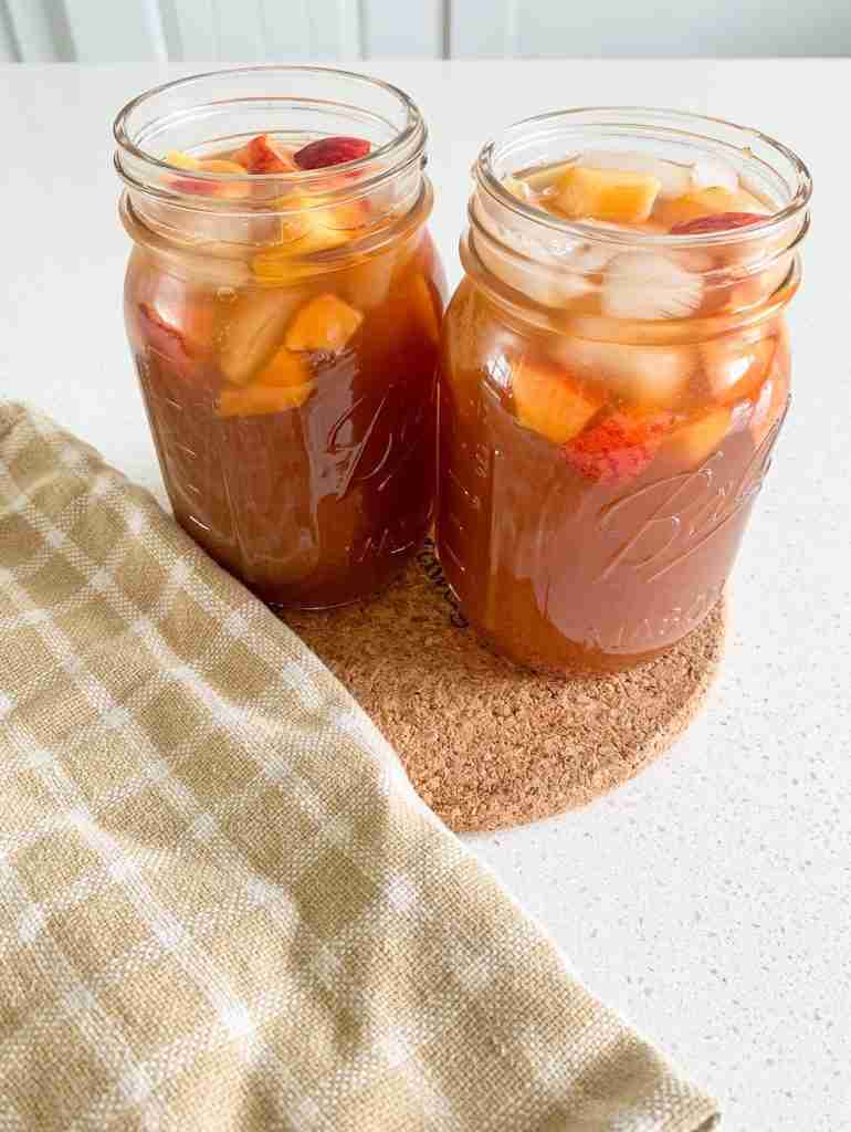 two glasses of iced peach tea