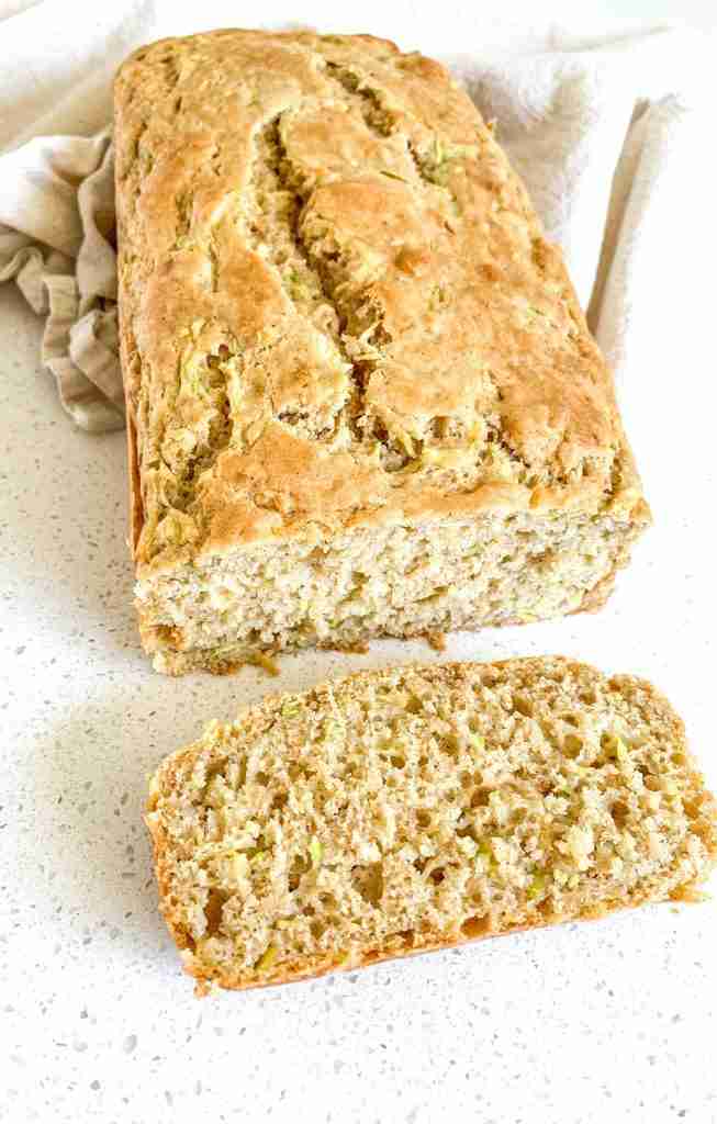 bread loaf on a towel on the counter cut open