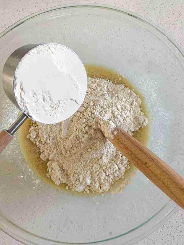 flour being added to wet ingredients