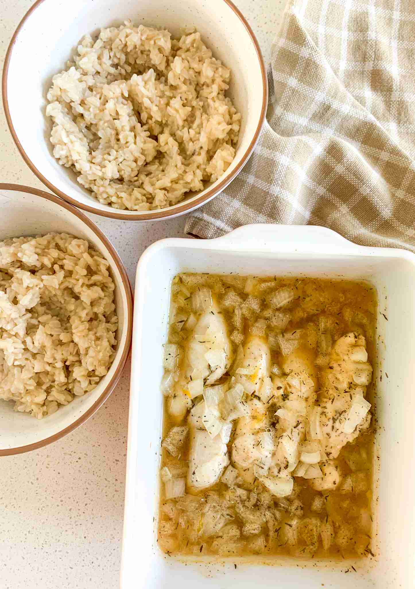 casserole dish of chicken and 2 bowls of rice