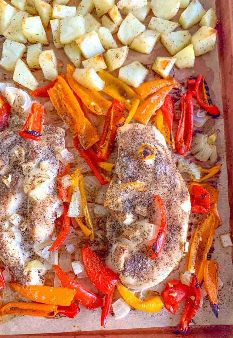 sheet pan with chicken potatoes onions and peppers