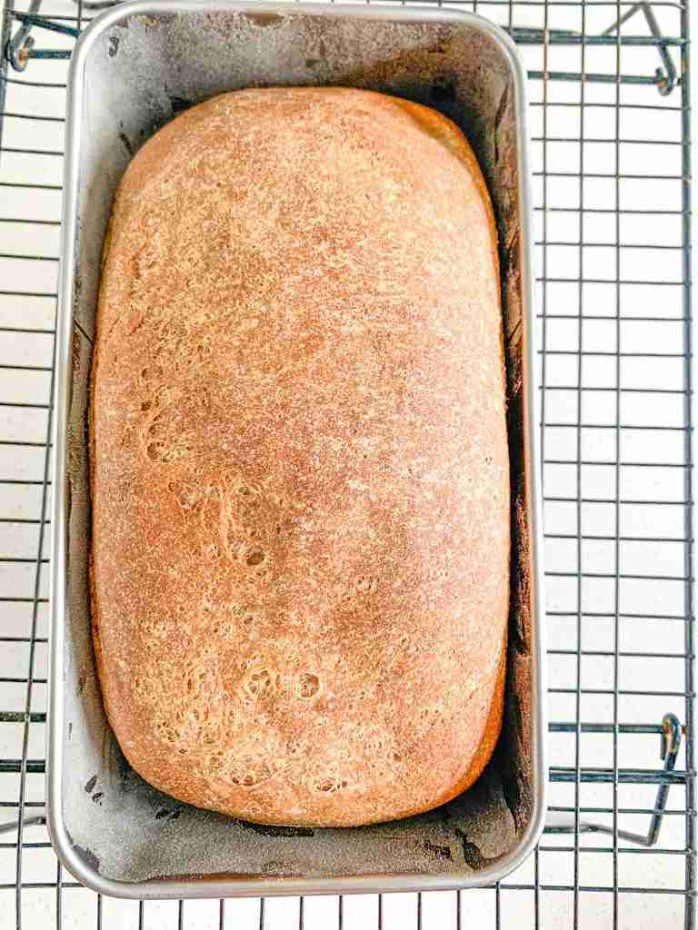 over head photo of bread loaf in it's loaf pan
