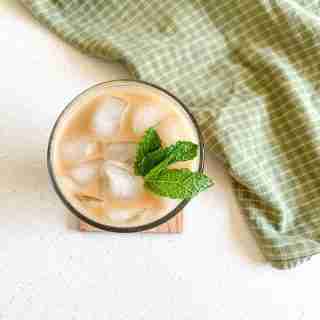 over head shot of an iced coffee with mint leaves