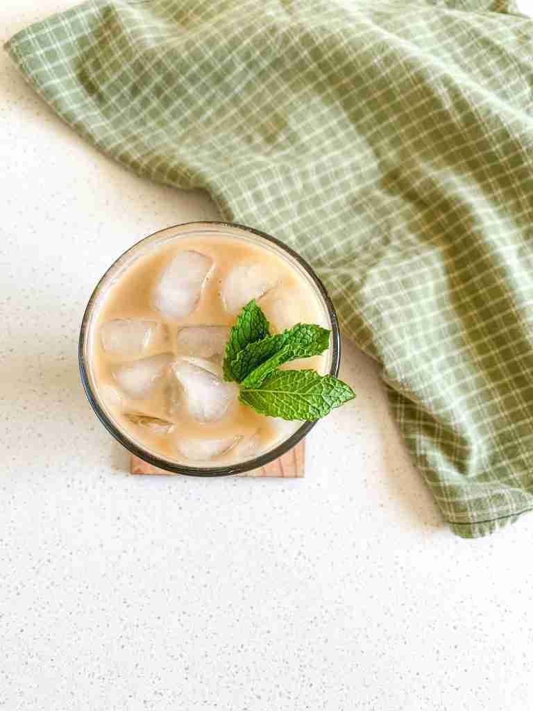 over head shot of an iced coffee with mint leaves