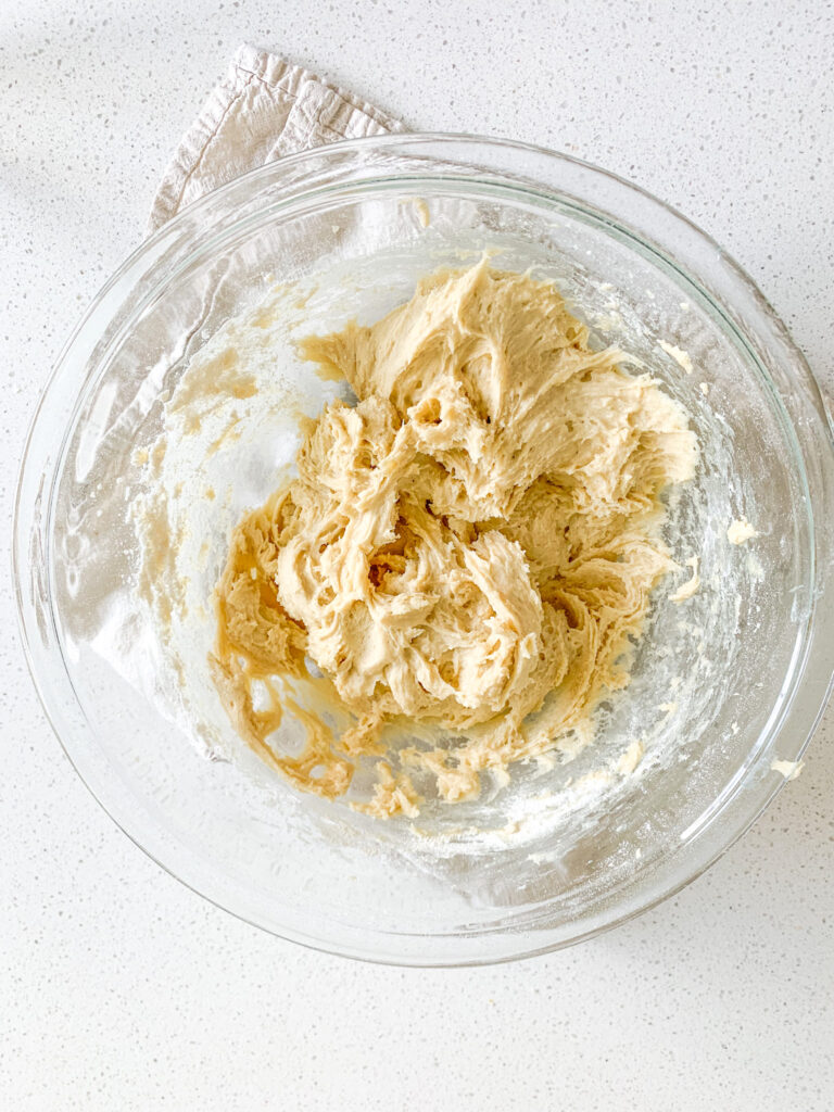 sourdough sugar cookie dough mixed together in a bowl
