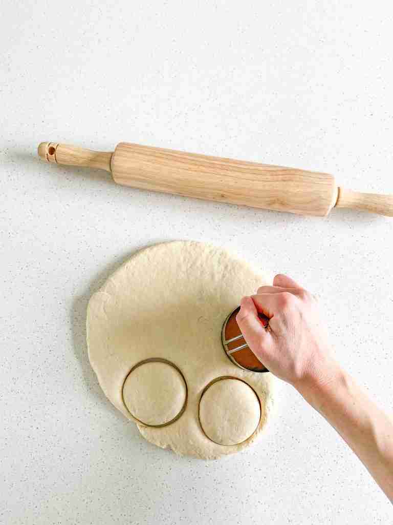 cutting out sourdough english muffins
