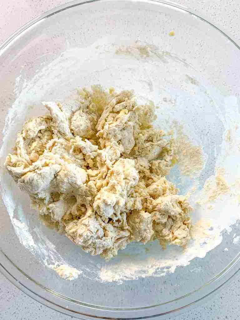shaggy croissant dough in a bowl