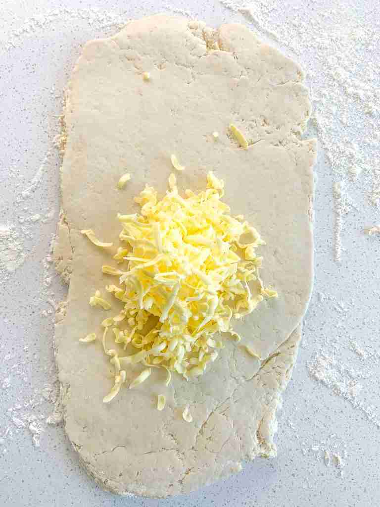 grated butter in center of croissant dough