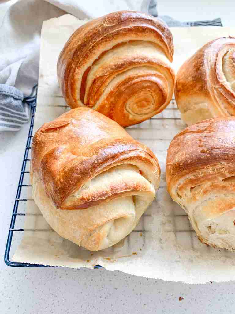 freshly baked sourdough croissants that are flaky
