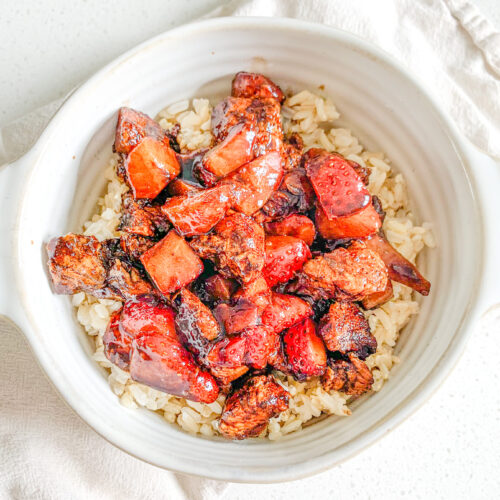 freshly made pan-seared balsamic strawberry chicken bites on a bed of brown rice