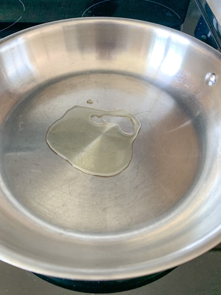 avocado oil heating up in a pan