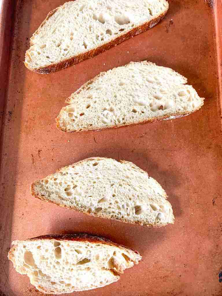 slices of bread on a sheet pan