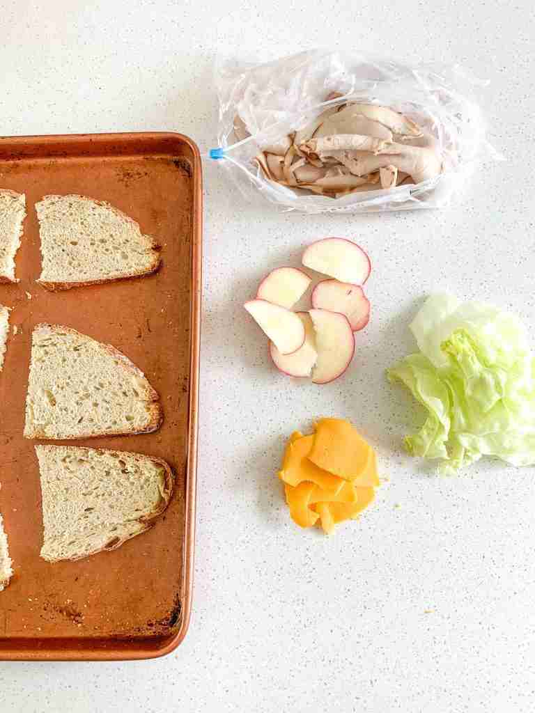 sandwich items laying out to make sandwiches