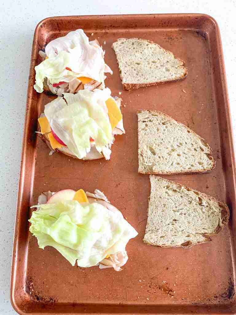 sandwiches with turkey, cheese, apple, lettuce