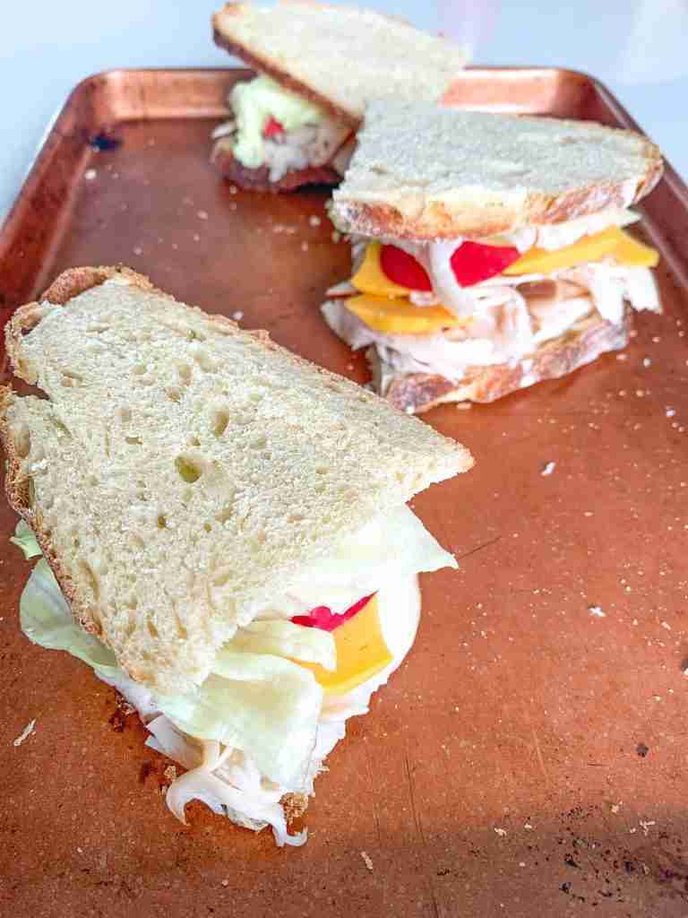 sandwiches with turkey, cheese, apple, lettuce