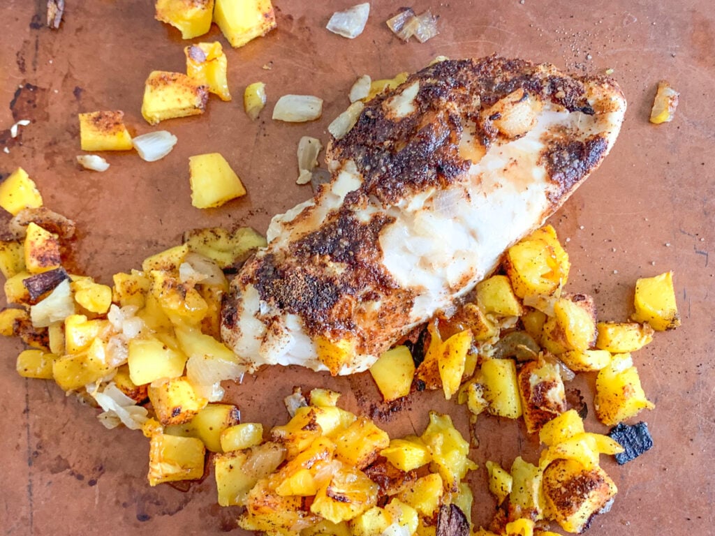 chicken and mangos resting after cooking before shredding