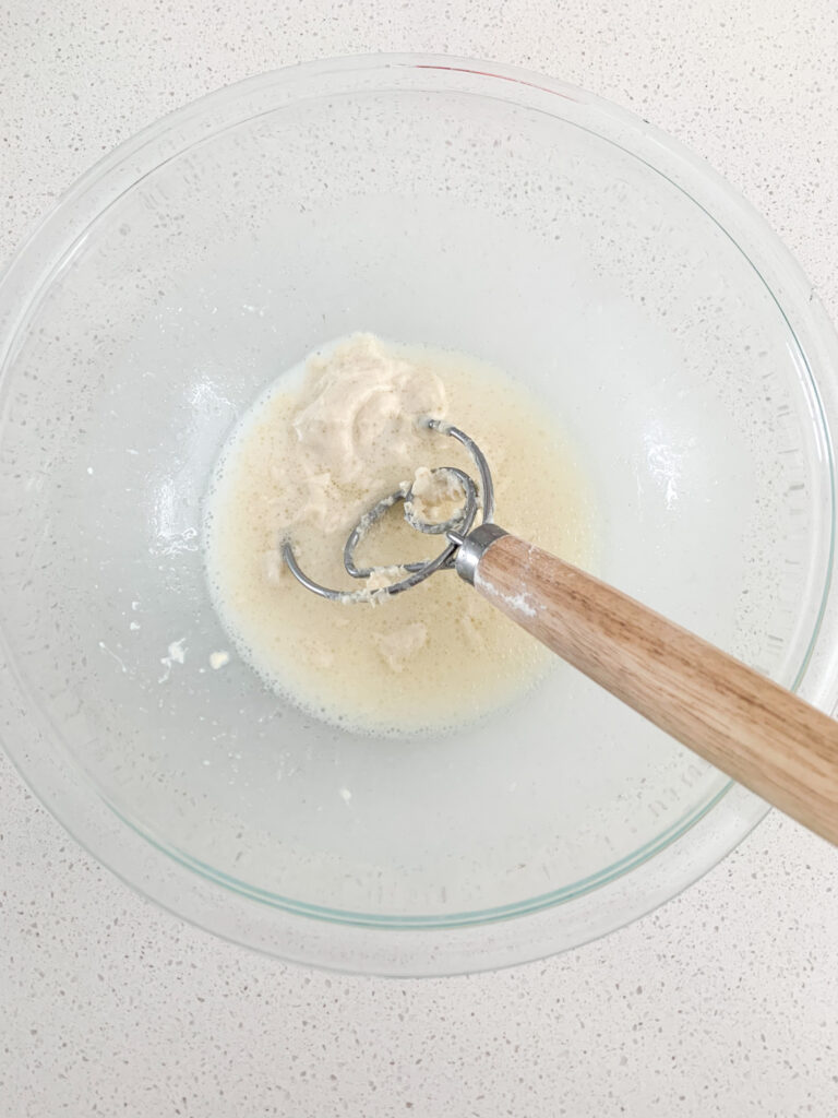 mixing wet ingredients for bun dough