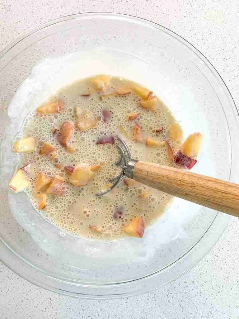 wet ingredients mixed into waffle batter