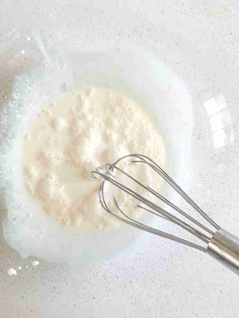 starting to whisk heavy whipping cream, vanilla, and sugar