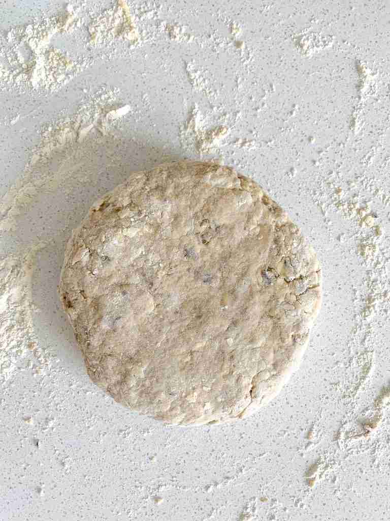 disk of scone dough sitting on the counter