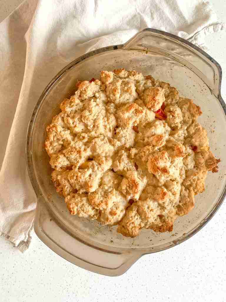 baking dish of sourdough peach cobbler