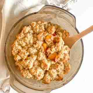 baking dish of sourdough peach cobbler