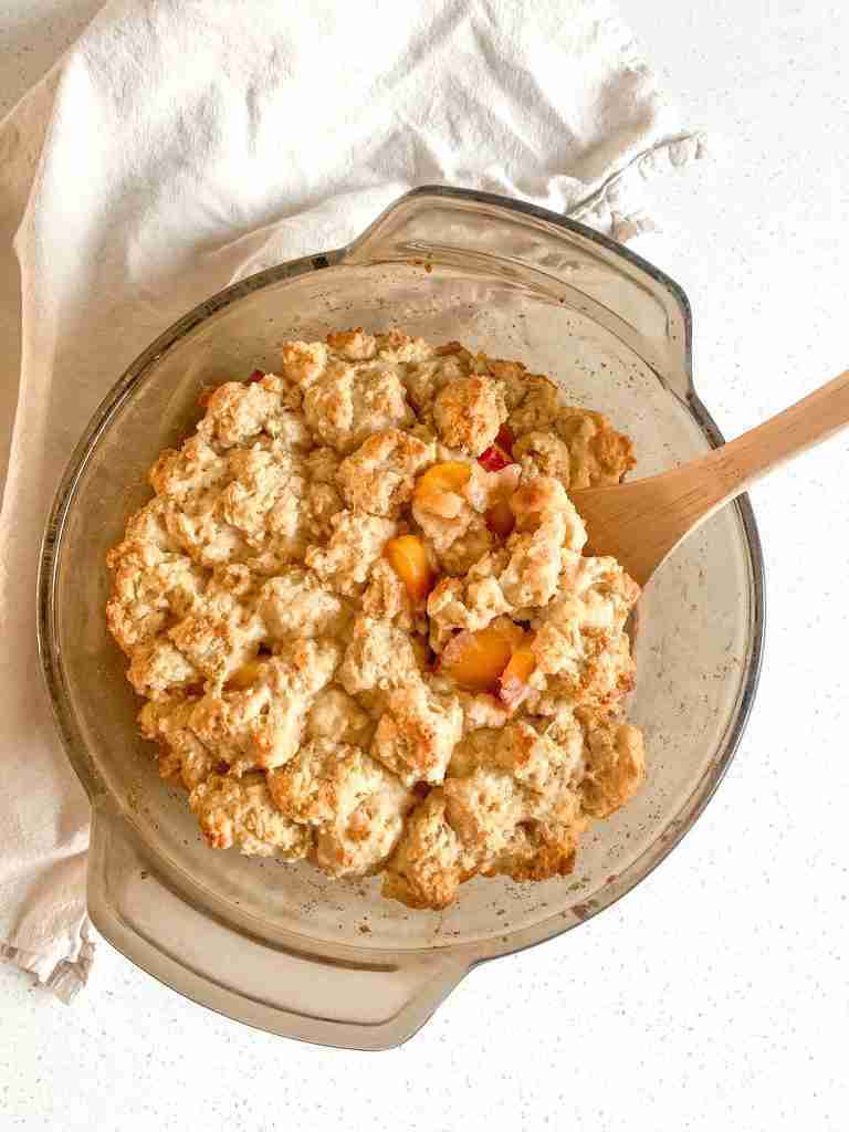 baking dish of sourdough peach cobbler