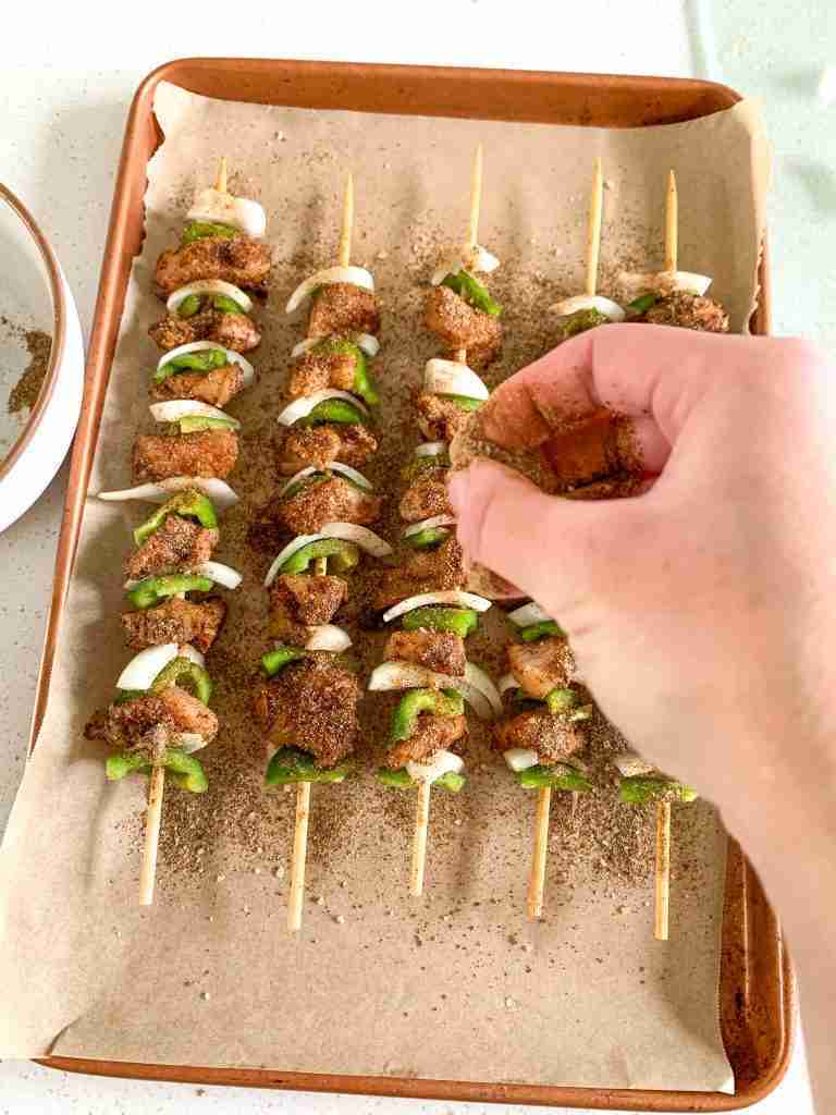 hand seasoning kabobs