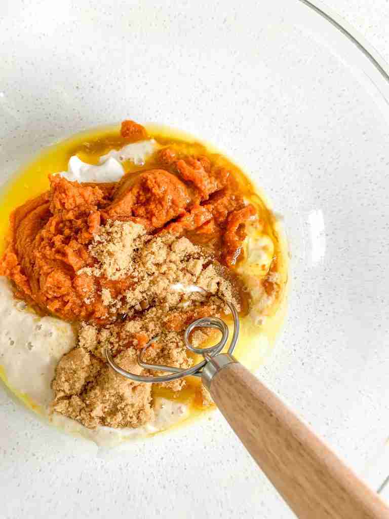 bowl full of ingredients to make pumpkin bread