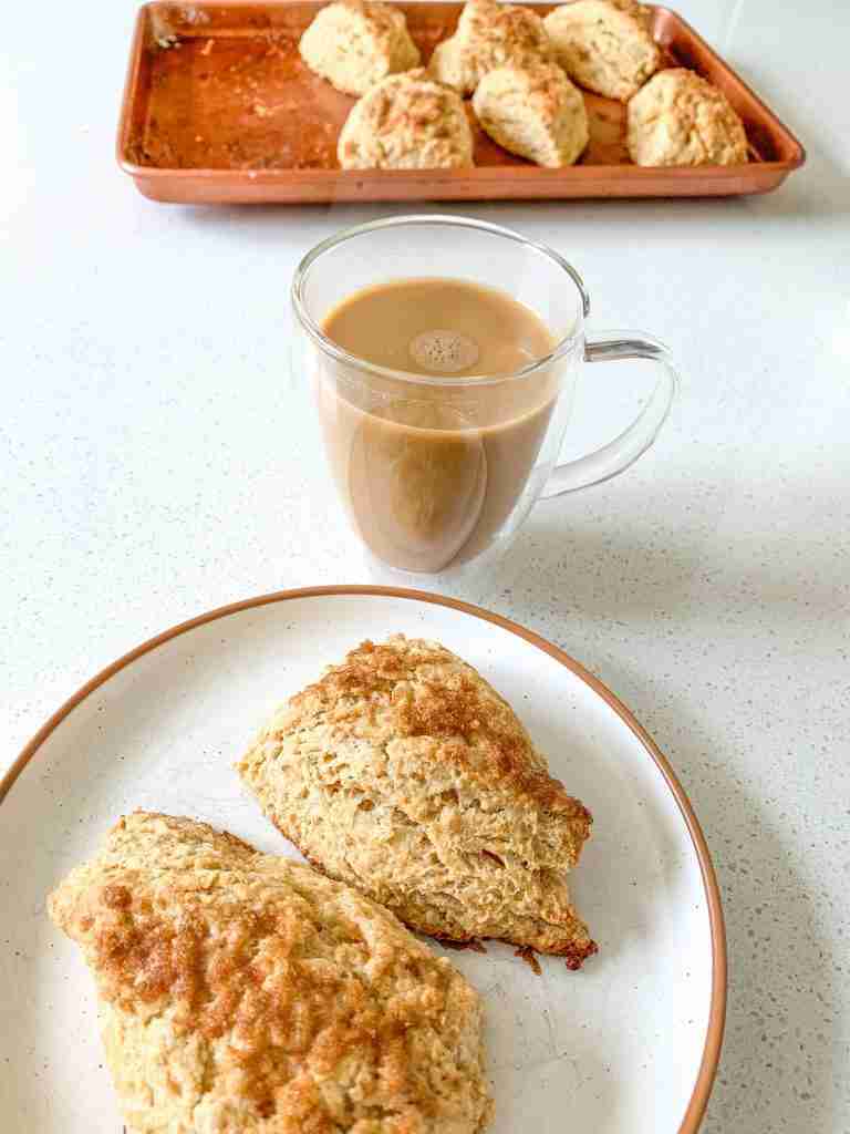 plate of cinnamon brown sugar scones and a cup of coffee