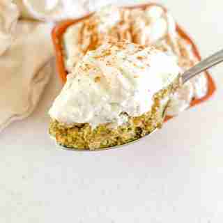 bowl of pumpkin chia pudding and a spoon of it
