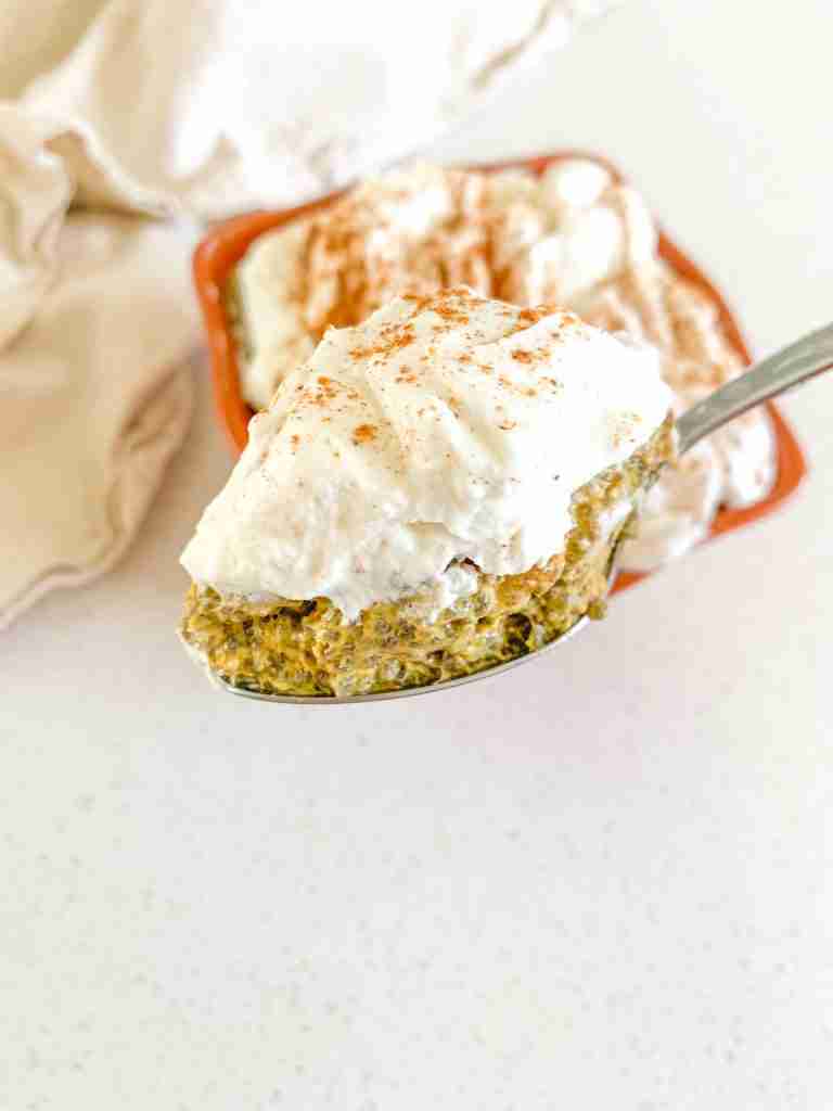 bowl of pumpkin chia pudding and a spoon of it